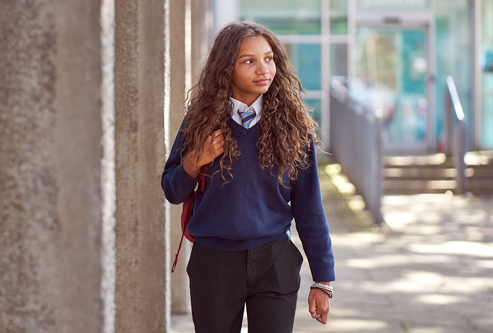 Teenage girl walking to class