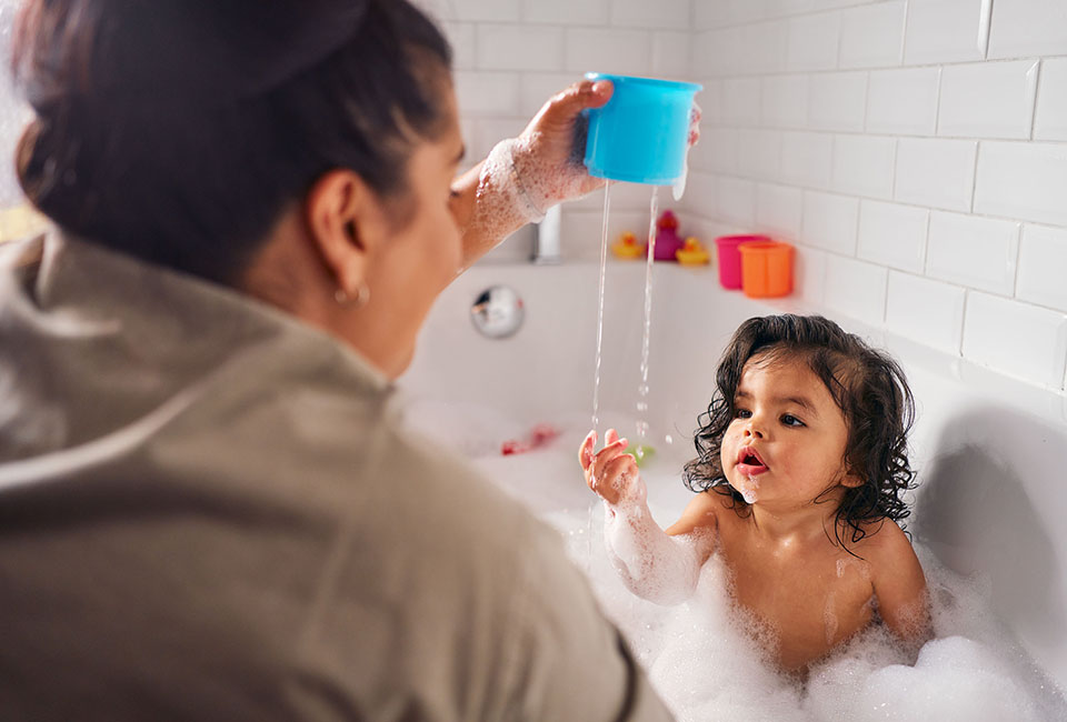 Mum bathing little girl