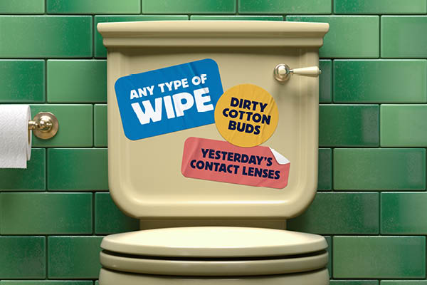 Toilet with stickers that say any type of wipe, dirty cotton buds and yesterday's contact lenses